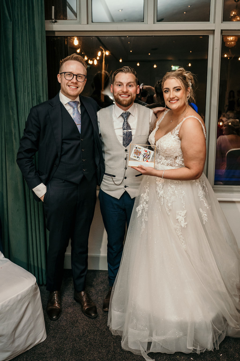 Newlyweds presented with a framed playing-card keepsake by Kristian