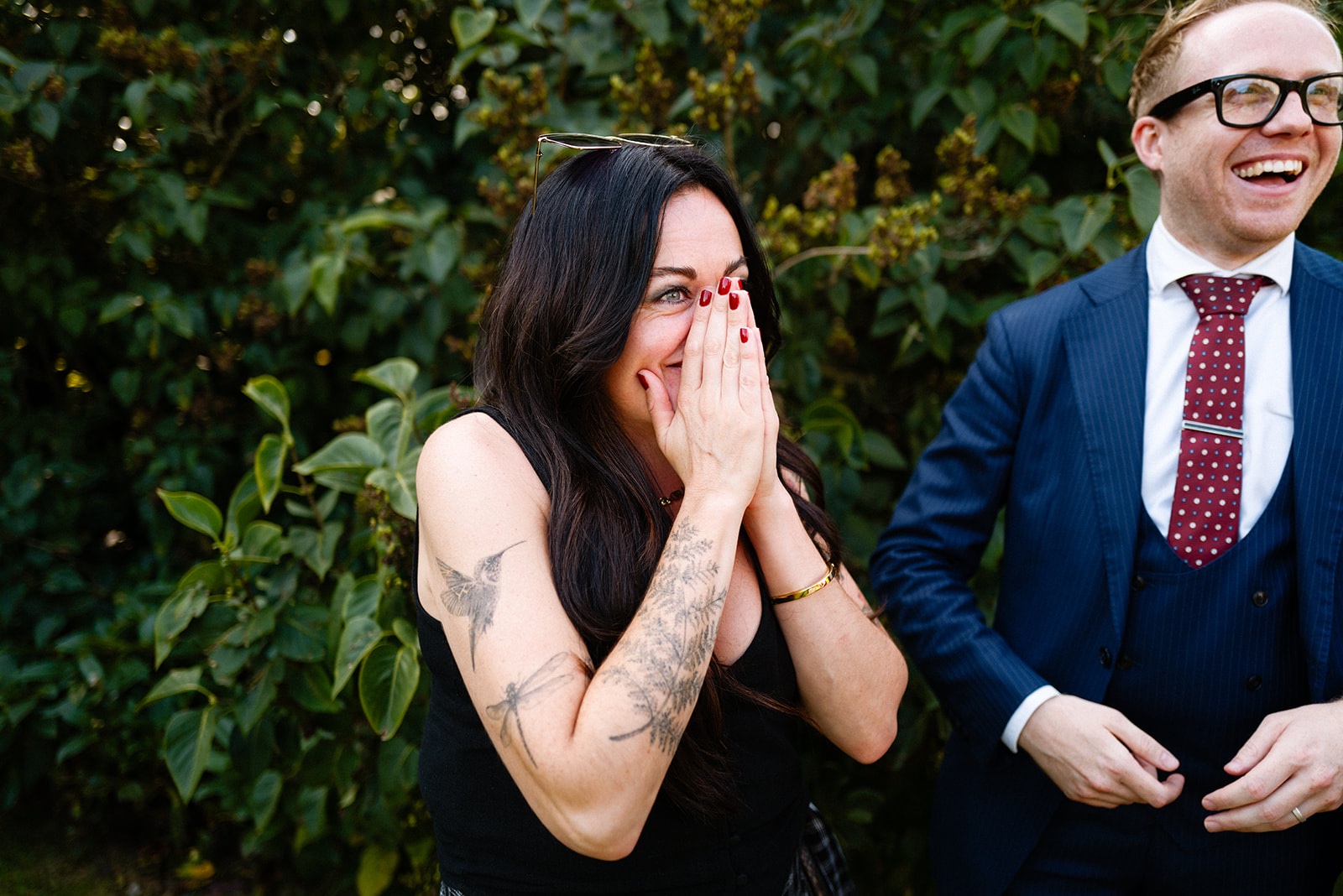 Two guests reacting with shock at a reveal